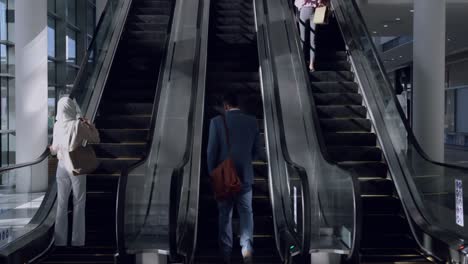 business people using escalator in a modern office 4k