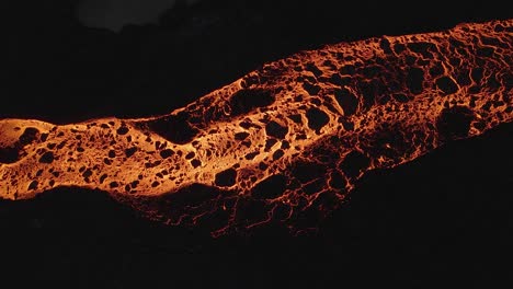 incandescent lava and black rocks