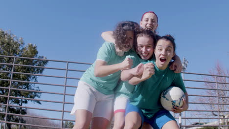 low angle shot of excited football teammates