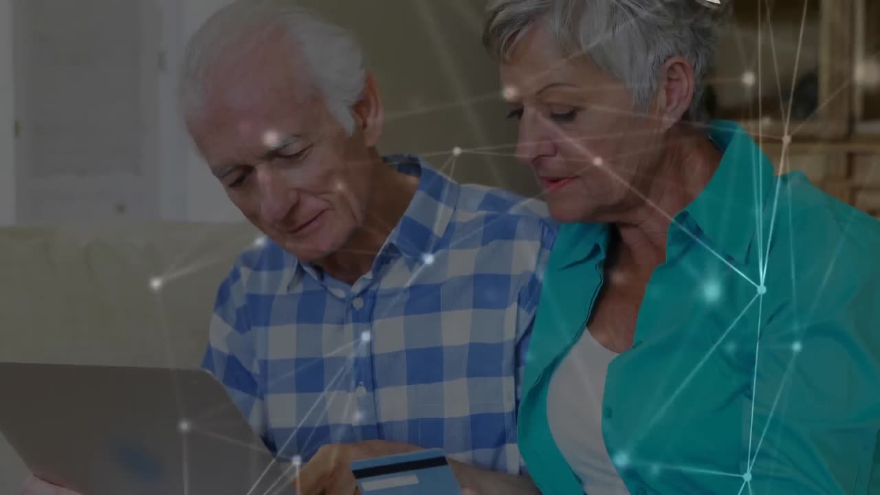 animación de redes de conexiones a través de una pareja mayor utilizando una computadora portátil