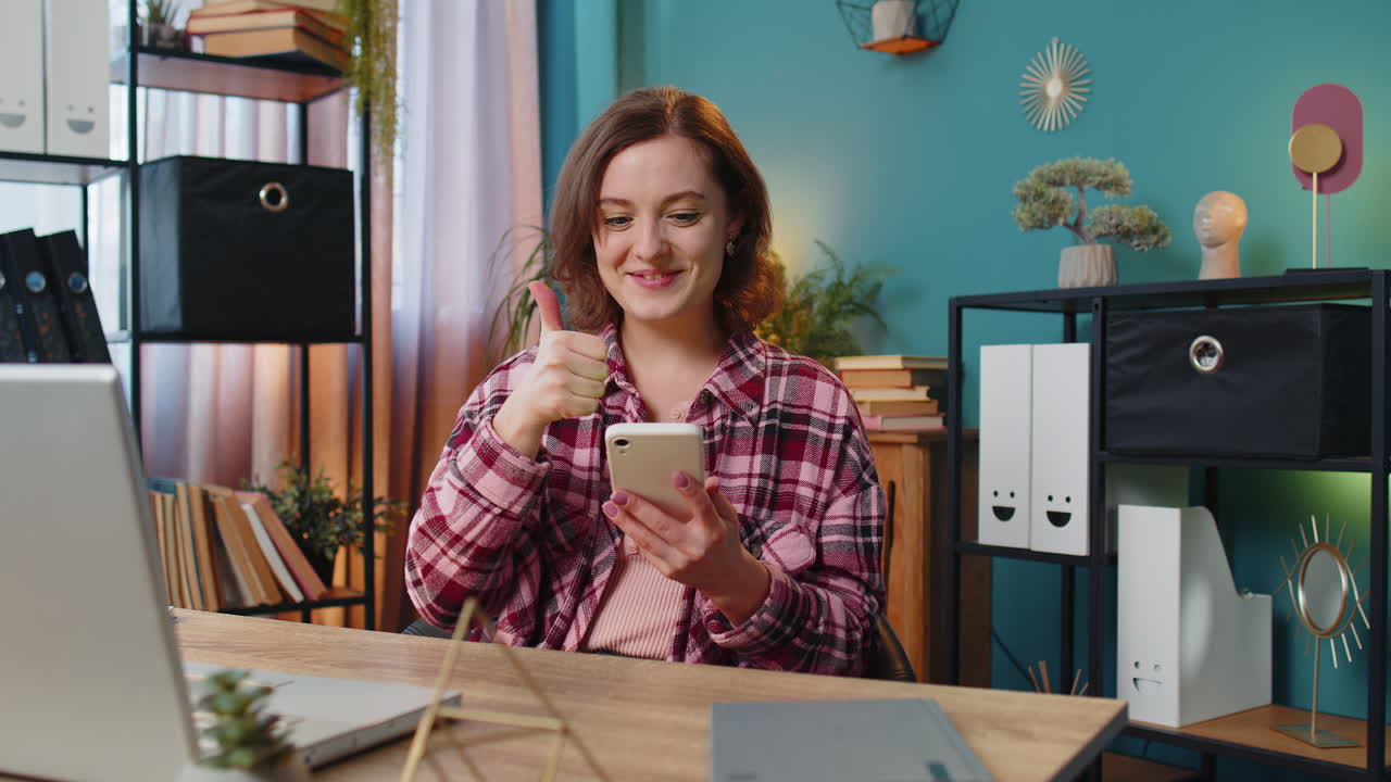 Business woman girl using smartphone social media app game online pointing showing like thumbs up