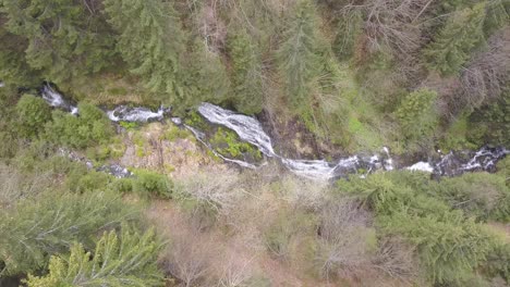 high aerial view from drone of rausor waterfall and surrounding forest