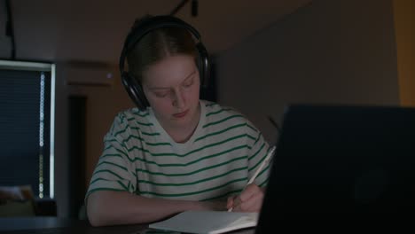 teenage girl studying late night