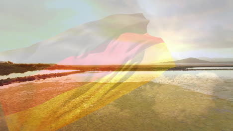 digital composition of waving germany flag against aerial view of the sea