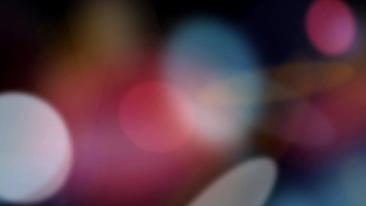 Sfondo astratto con sfere di luce bokeh morbide e colorate