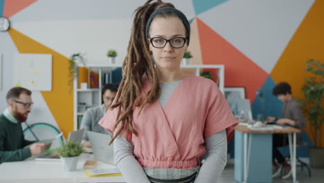 woman with dreadlocks in modern office
