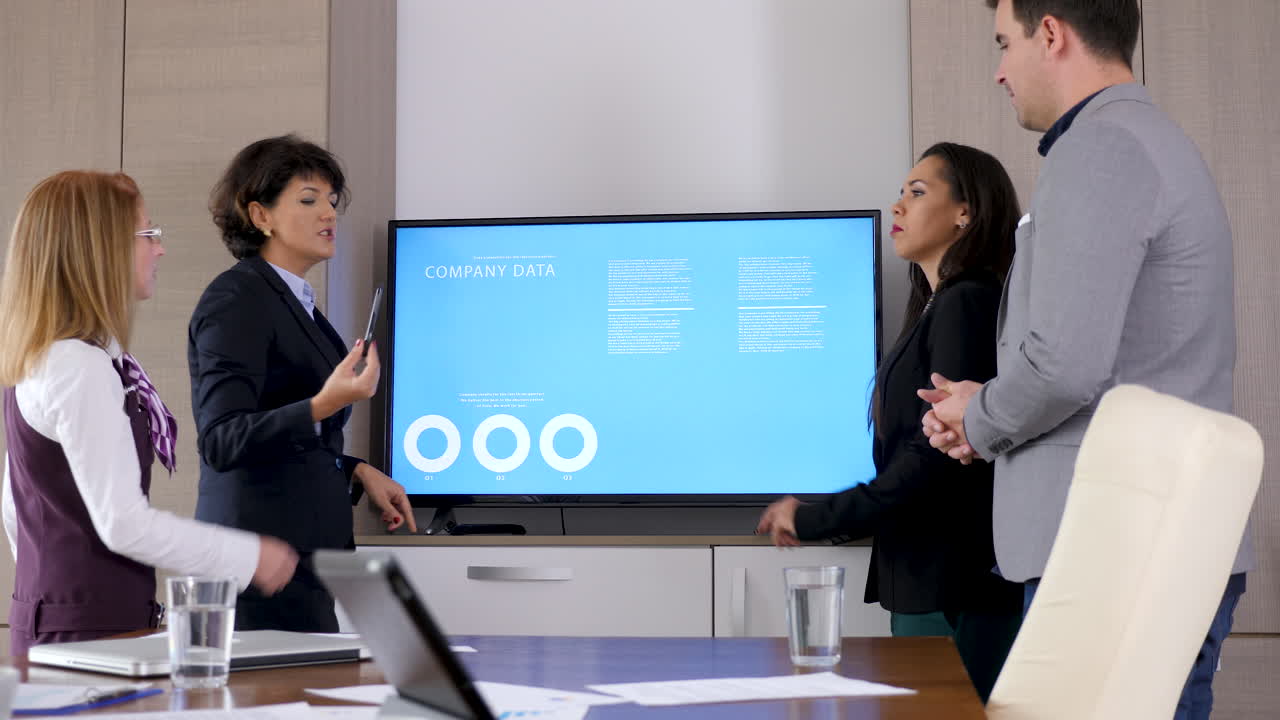 Business Team Analyzing Company Data in a Meeting