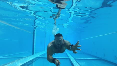 man diving in a pool melia innside calvia hotel