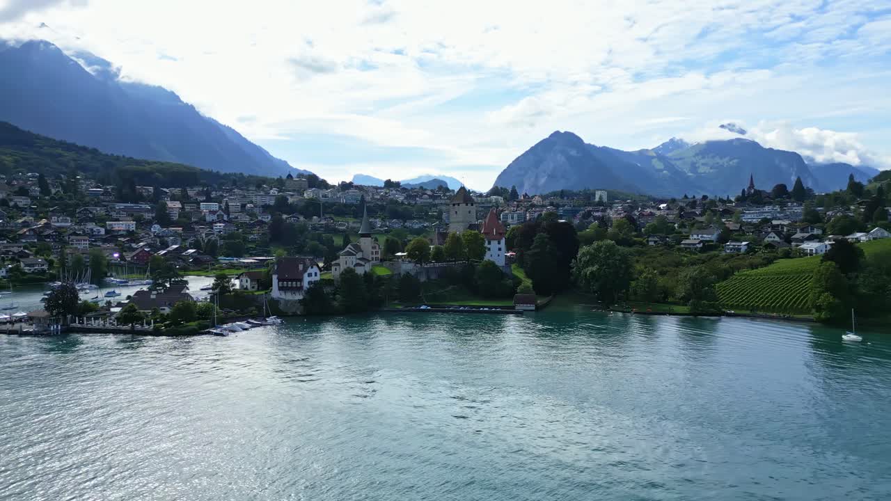 Orbit drone shot of Spiez castle in the Canton of Bern in Switzerland.