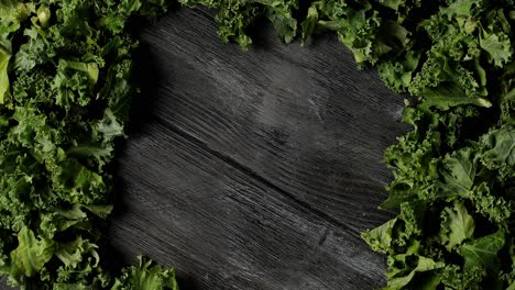 Composed-green-salad-leaves-on-wood