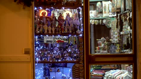 zoom out night shot of a souvenirs shop in italy during chrismas time