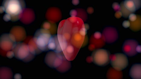 3d red semi-transparent heart rotating in loop on animated colored blurred bokeh background