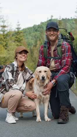 couple hiking with dog