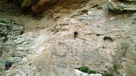 girl climbing to top of mountain