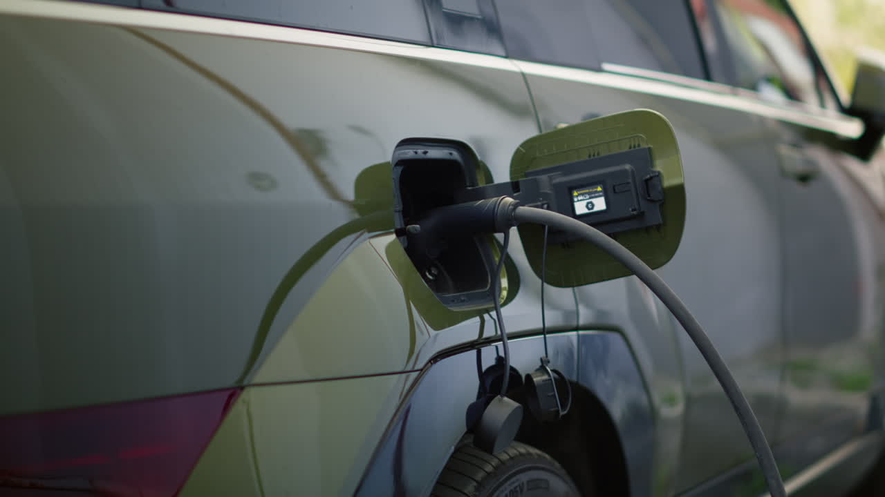 Close Up Shot Of Electric Suv Automobile Charging At Modern Station