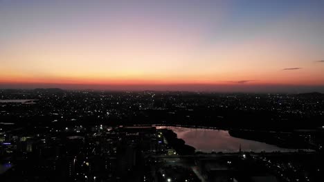 aerial view of chennai,india with orange skies. slow follow shot