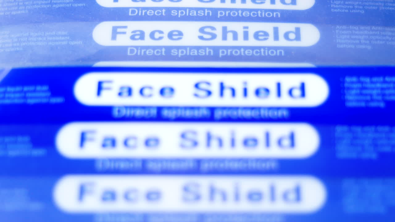 Panning shot of stack of face shield