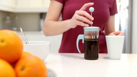 woman making coffee in kitchen 4k