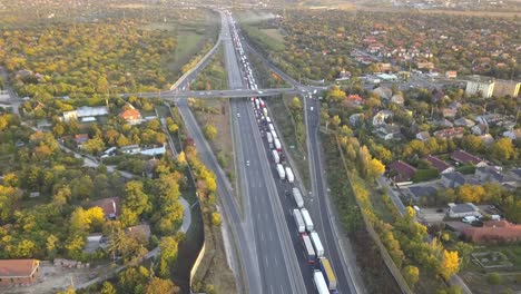 Aerial-forward-drone-view-over-congested-traffic-on-highway-and-bridge