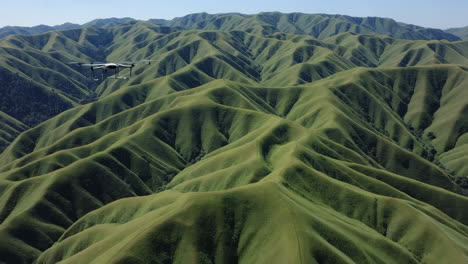 drone shot of rolling green hills