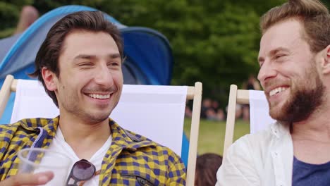 Two-buddies-drinking-beer-at-the-summer-festival