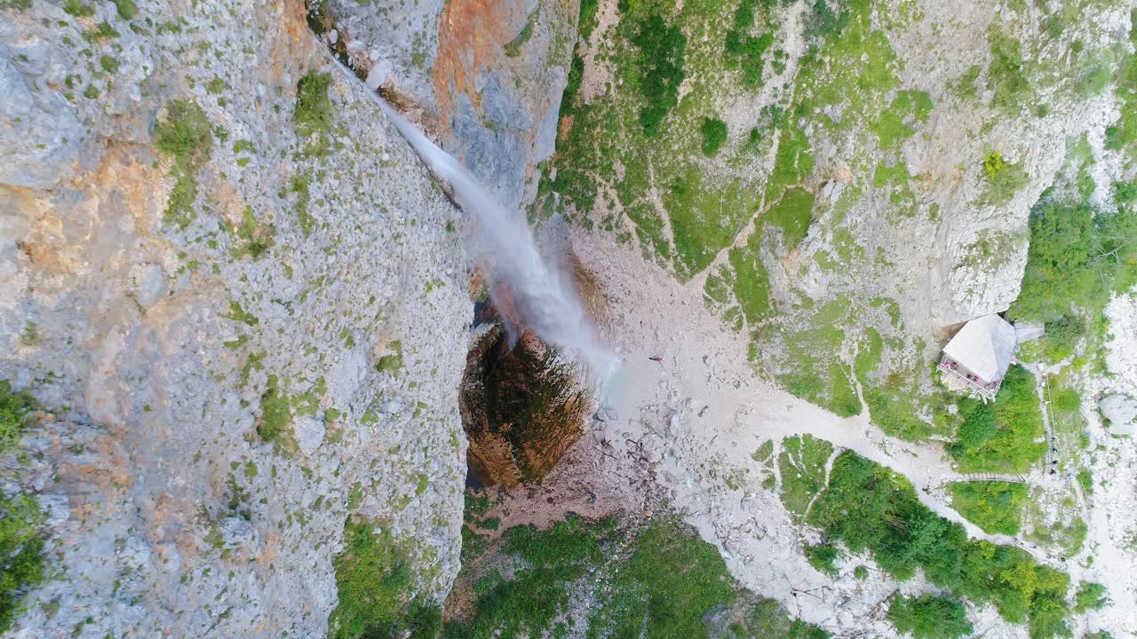 High aerial rising view of tallest Slovenian waterfalls, Rinka waterfall