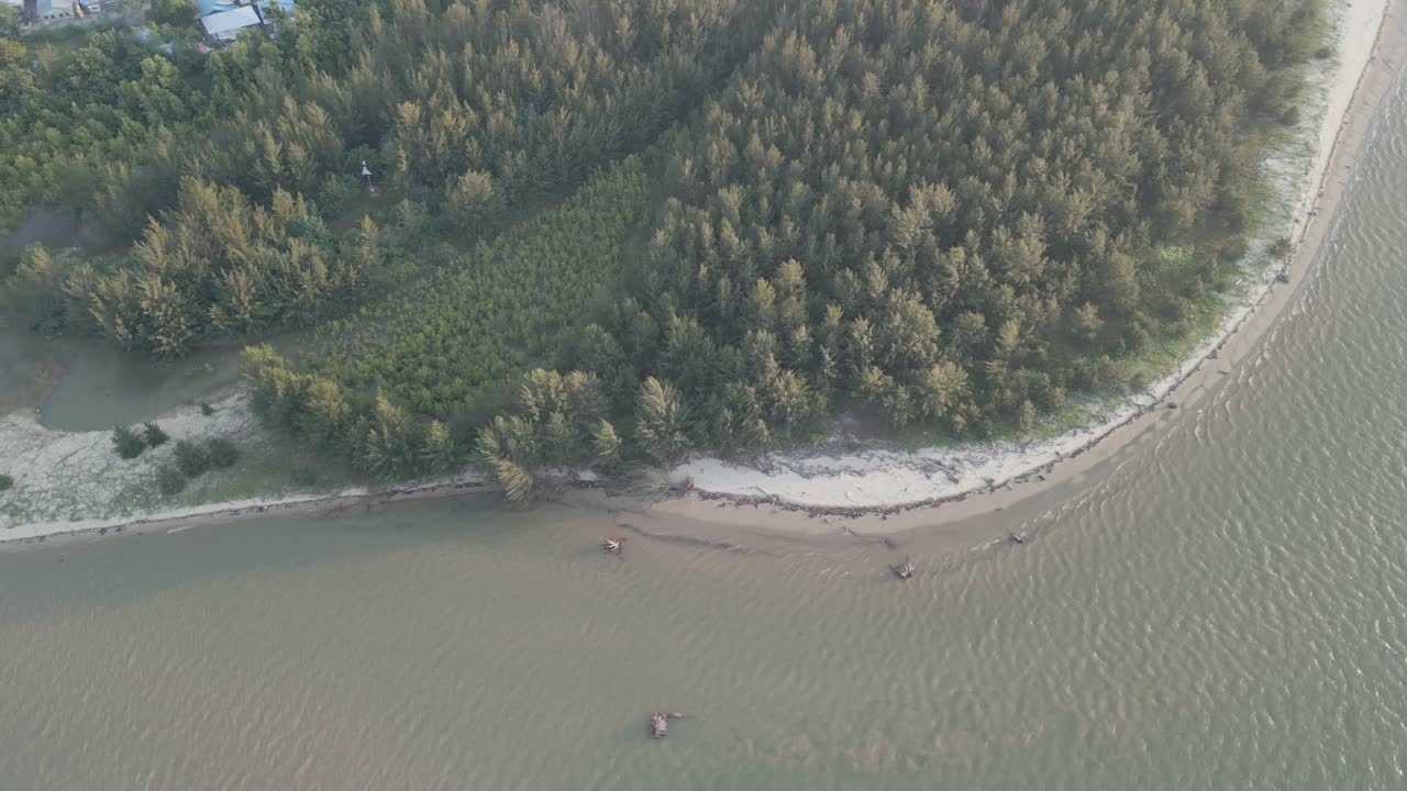 Aerial Drone View During Summer Gerigat Fishing Village,Kabong With, Facing Open Blue Sea, White Sandy Beach,Green Coconut, Palm Trees,And River,Sarawak,Borneo