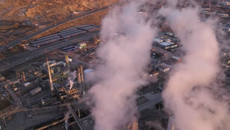 Aerial-Shot-from-Pollution-at-Refinery-in-Salt-Lake-City-Utah---Forward-and-Tilt-up-Movement