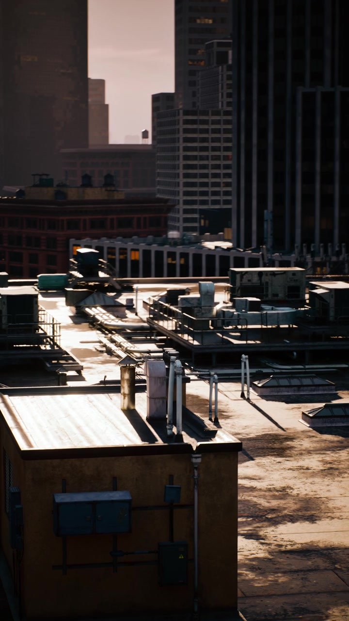 City rooftops glow in sunset light with urban skyline in the background
