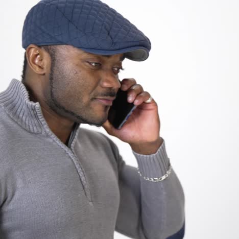 afro man talking on mobile phone. portrait of african man talking on the phone isolated