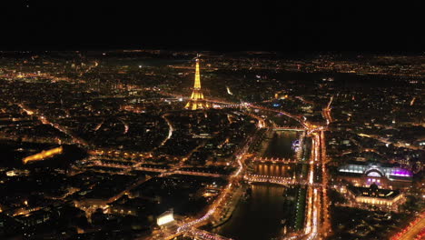 París-De-Noche-Torre-Eiffel-Río-Sena-Toma-Aérea-Ciudad-De-Las-Luces-Francia