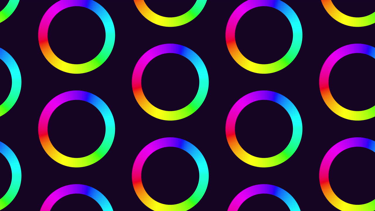 A vibrant array of colorful circular shapes forming a circular pattern on a dark background, creating a visually striking and mesmerizing image