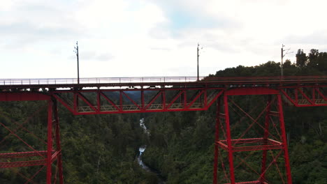 makatote viaduct metal train bridge spanning forest ravine and river in new zealand