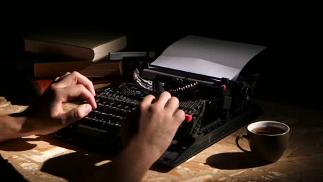 Person Typing on a Vintage Typewriter at Night