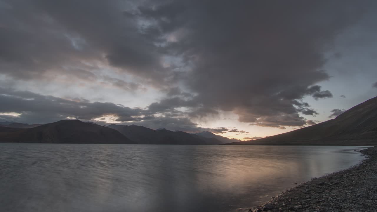 Sunrise or Sunset over a Mountain Lake