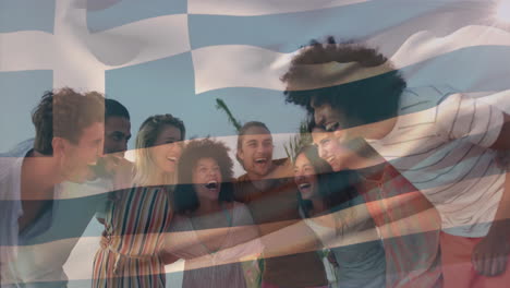 animation of flag of greece, low angle view of diverse laughing friends forming human chain at beach