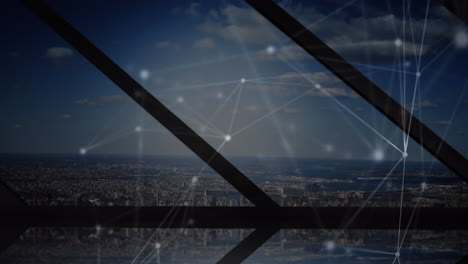 animation of network of connections against view of cityscape from office window