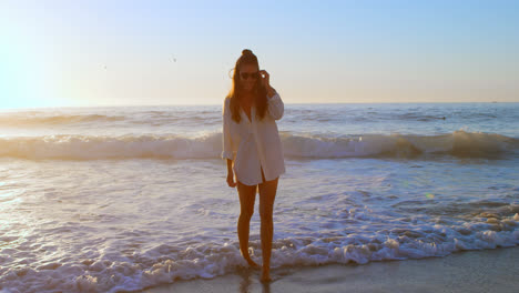 woman posing in sunglasses in the beach 4k