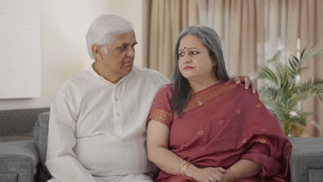 Serious-Old-Indian-couple-staring