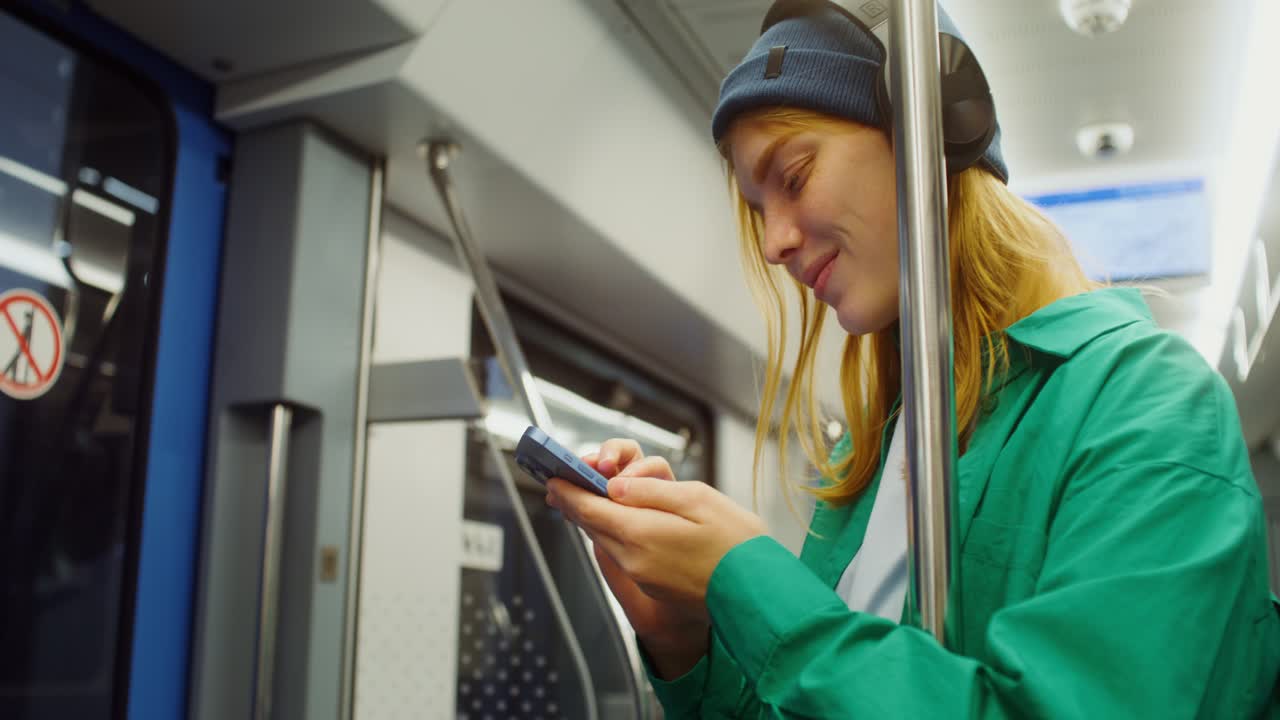Woman on subway using phone