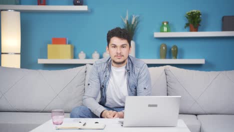 Man-looking-negative-at-camera.