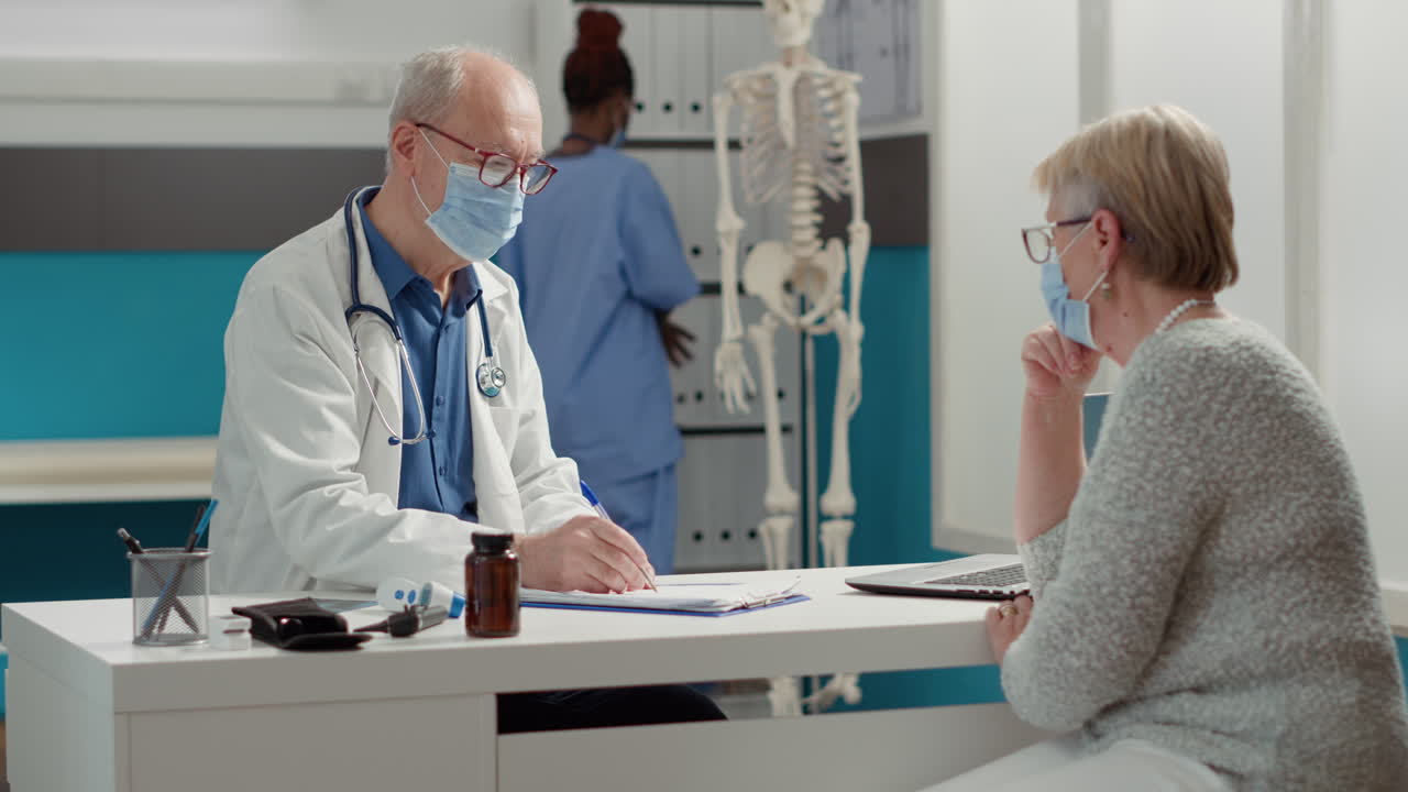 General practitioner taking notes on medical checkup papers