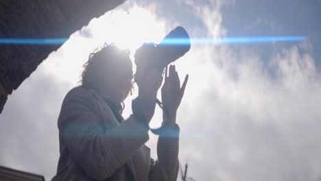 woman photographing the sky