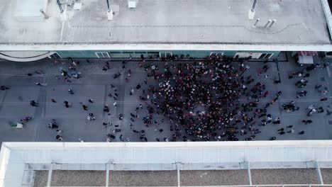 aerial dolly shot above a large crowd at the zone atristique temporaire event