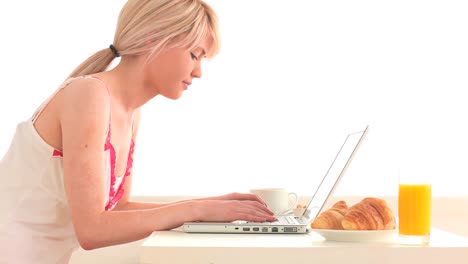 Attractive-woman-surfing-on-her-laptop