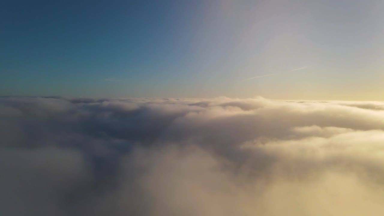 Aerial view of above the clouds before sunrise