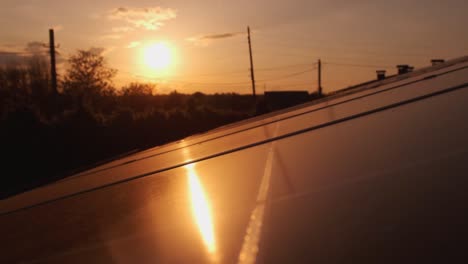 concept of green renewable energy and future innovations alternative energy. amazing sunset aerial view of solar panels stand in a row in the fields green energy landscape electrical power ecology