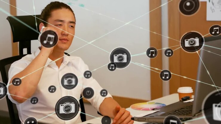 Animation of network of connections with icons over asian man in office