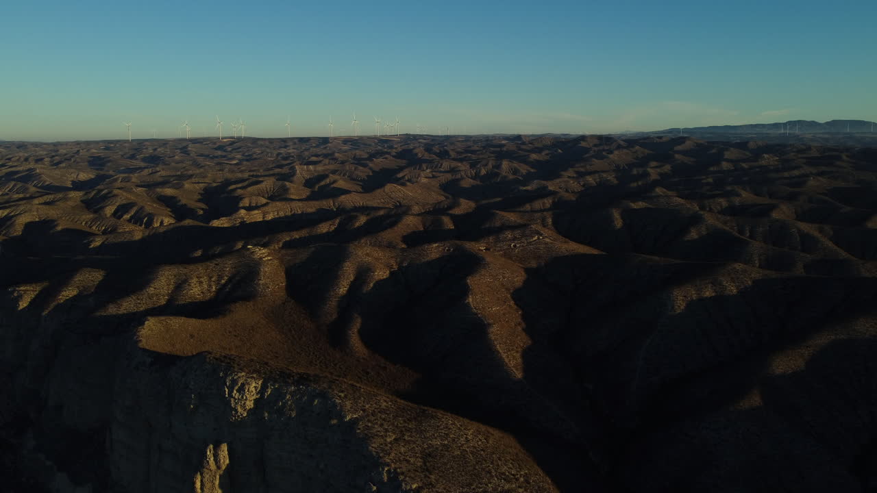 Aerial View of a Desert Landscape with Wind Turbines