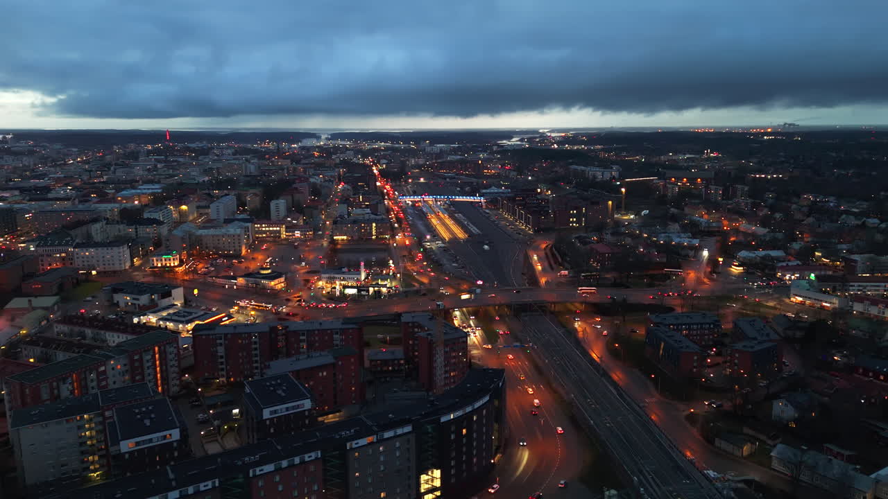 Drone shot circling the Main railway station, dramatic evening in Turku, Finland